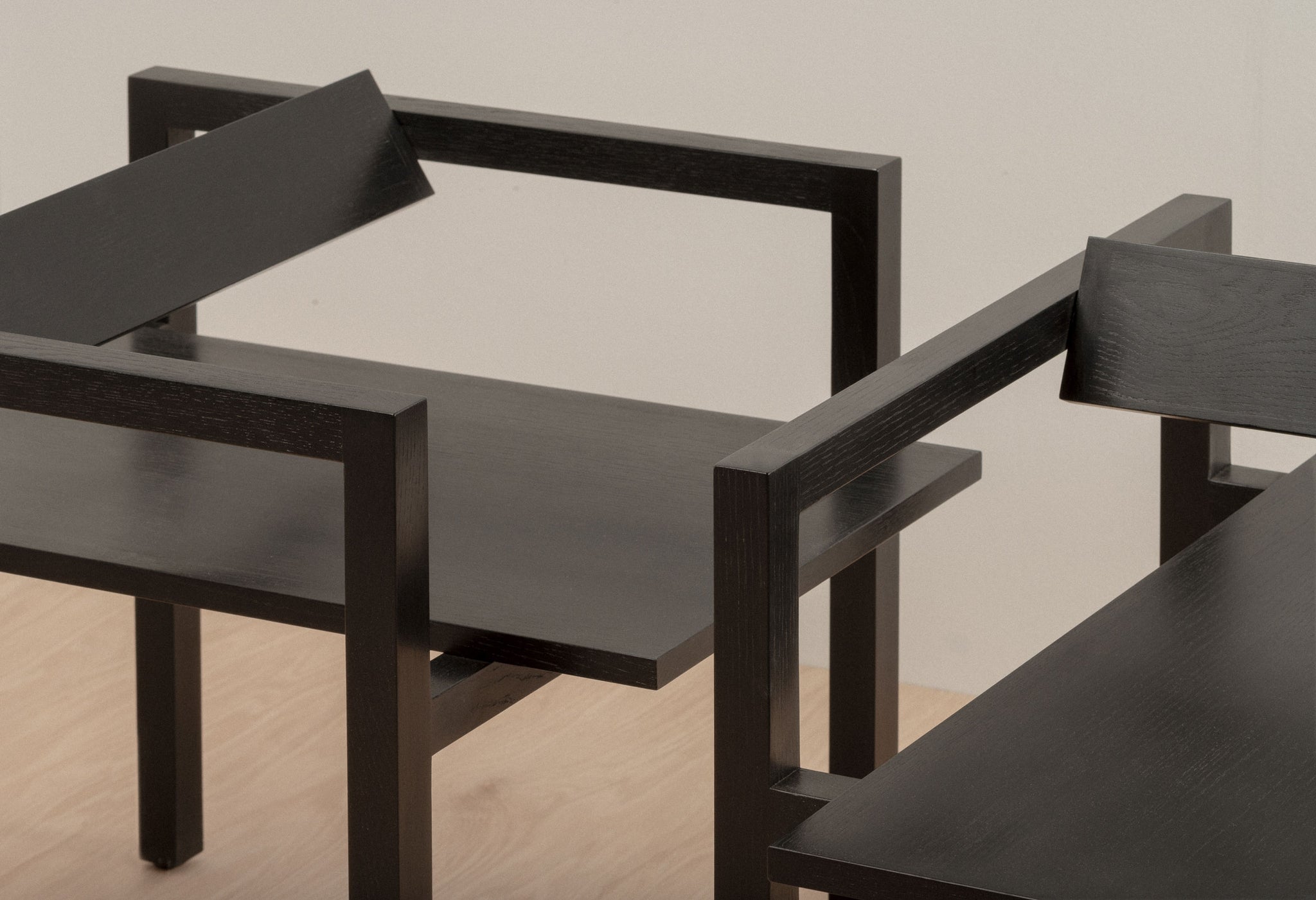 Close-up of two black Box Chairs