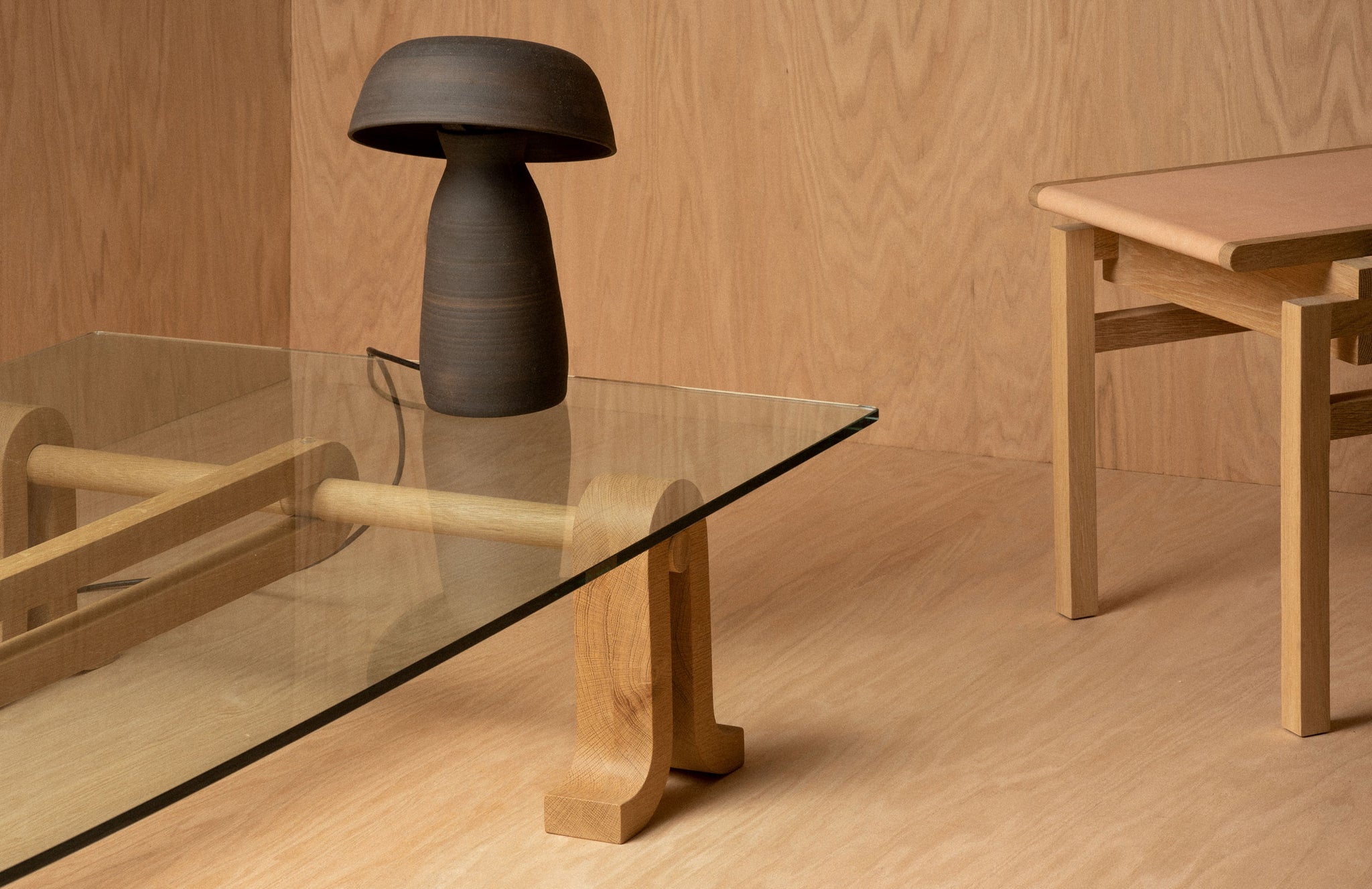 Black Mushroom Lamp sat atop the glass table-top Loop Table