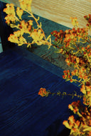 Close up shot of the grain on the  Blue finish Anything Chair