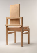 Tall Boy chair shot from behind lit on a white back drop