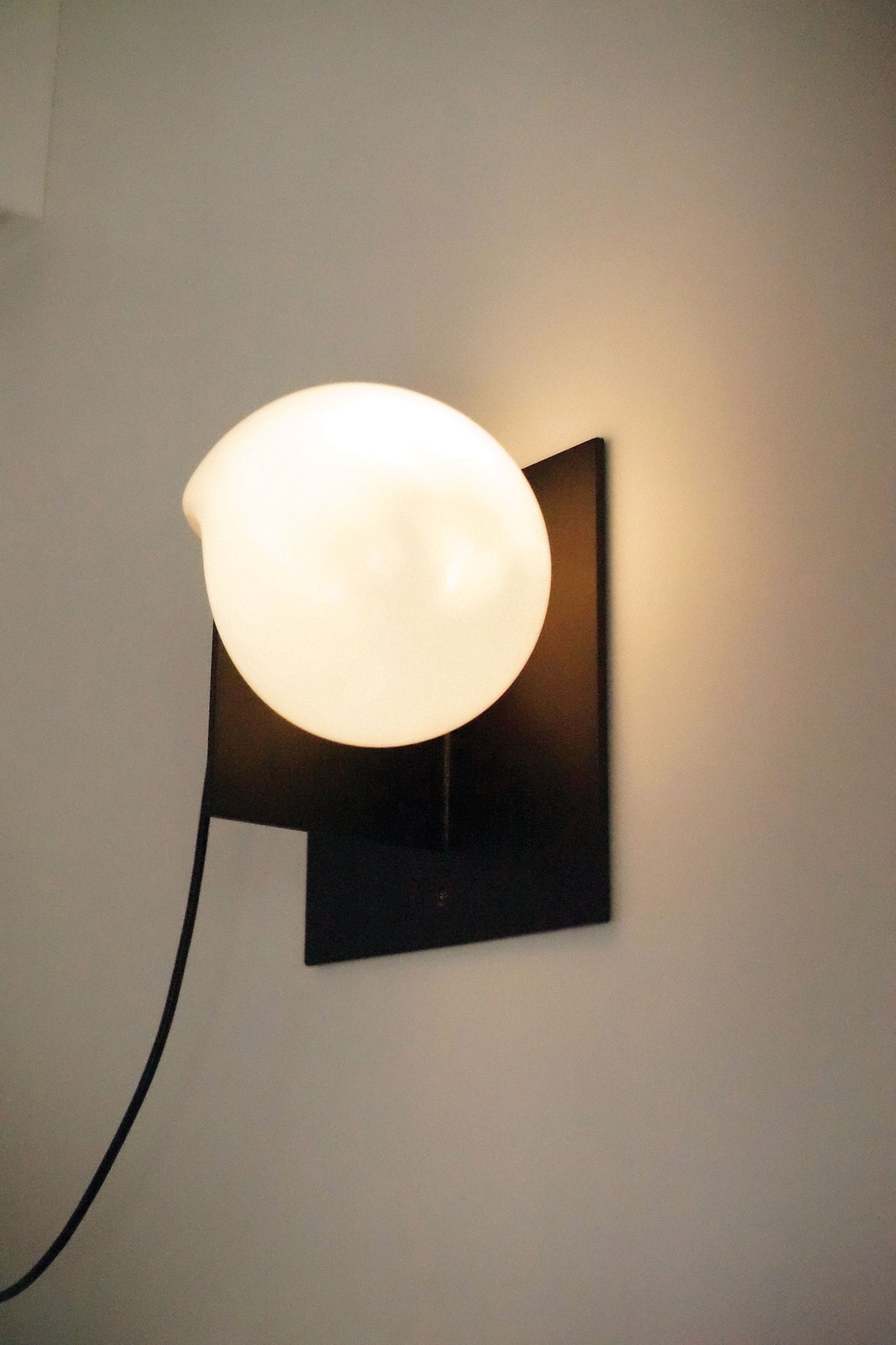 Close-up of a single Bloop Sconce