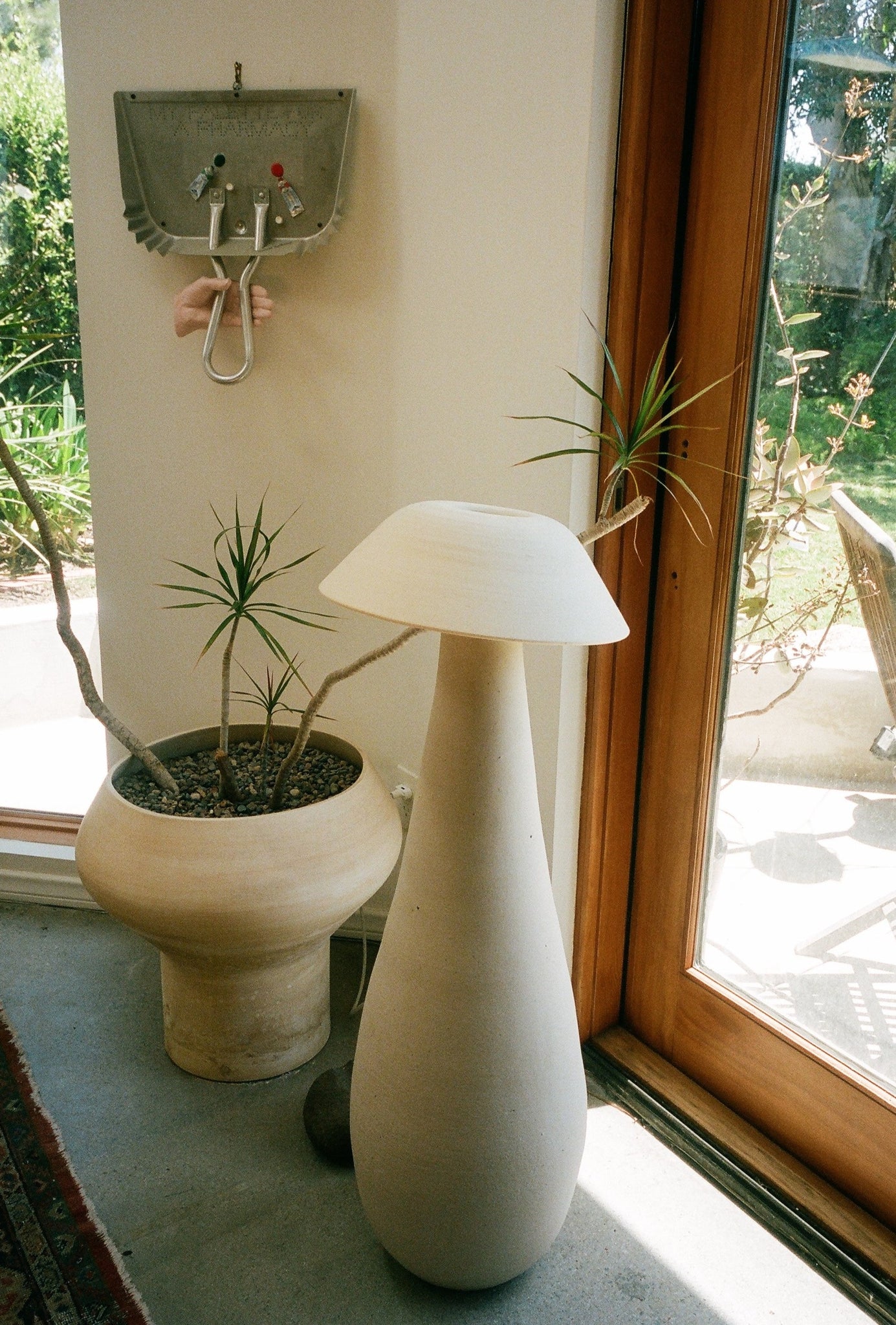 Mushroom Floor Lamp in the corner of a room next to a potted plant.